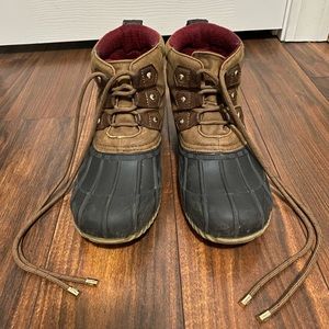 Brown and black “duck” boots.